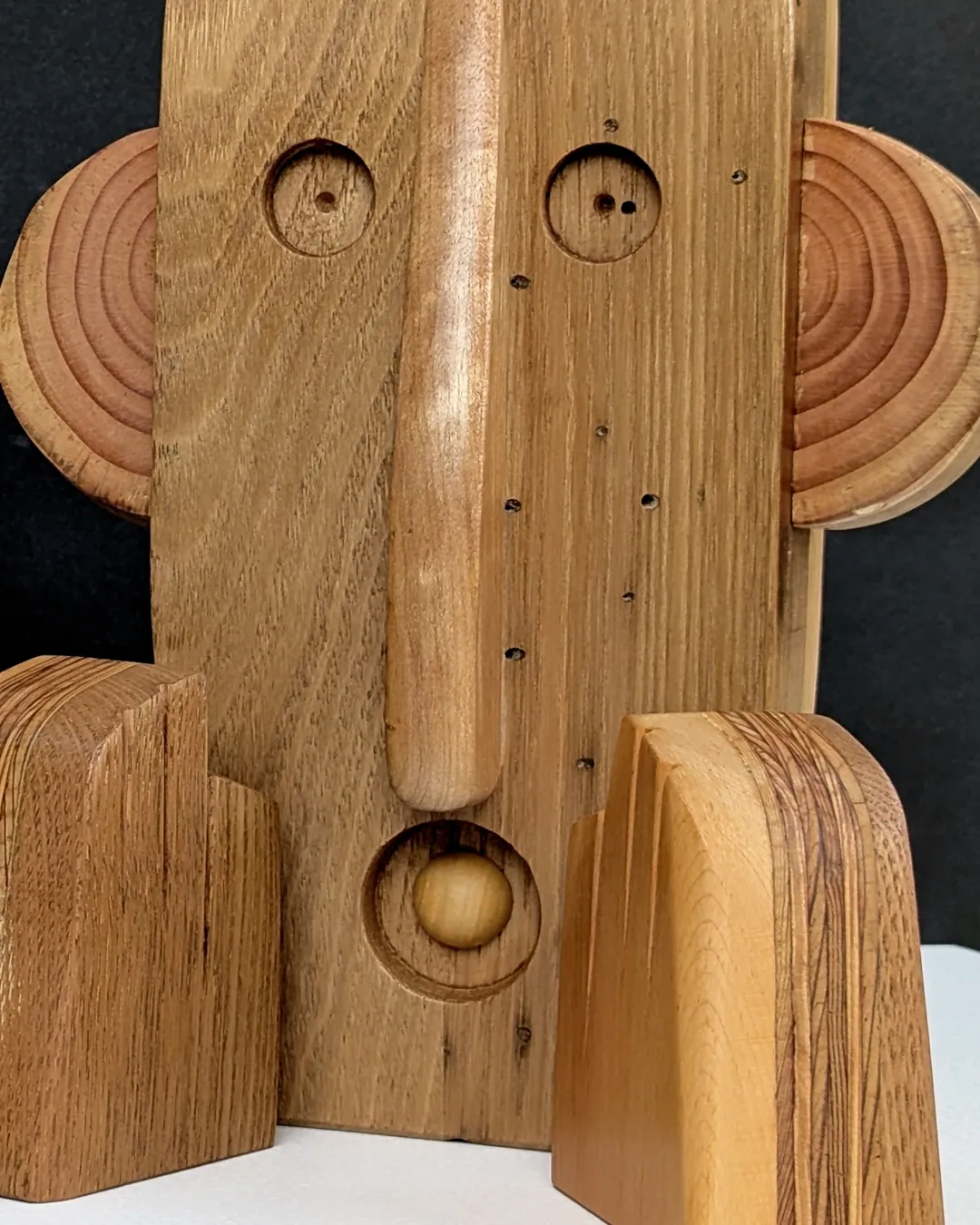 FACES by Giles Runeckles suspended by the custom boom lamp stand.